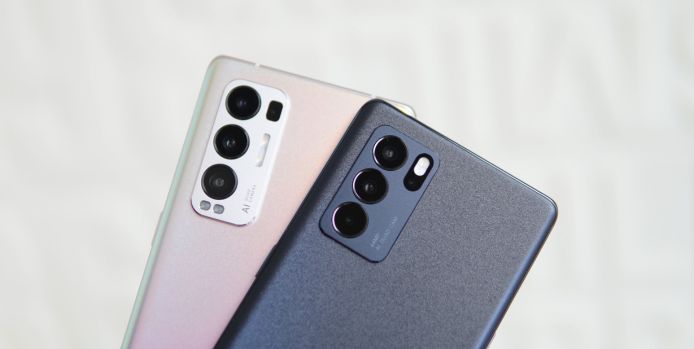 Close-up of two modern smartphones showcasing their multi-lens rear camera setups, one in a metallic finish and the other in a matte finish.